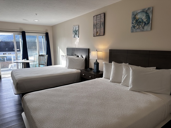 Double Queen Suite with Partial Ocean View Photo 1